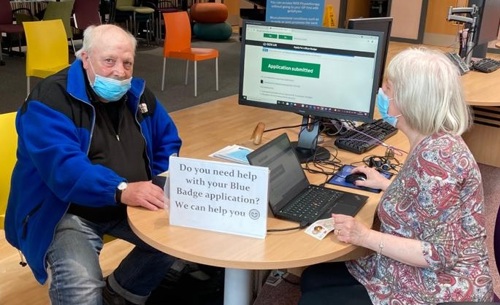 A Walkden resident gets help with his Blue Badge application